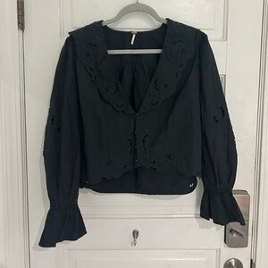 FREE PEOPLE eyelet embroidered black top.